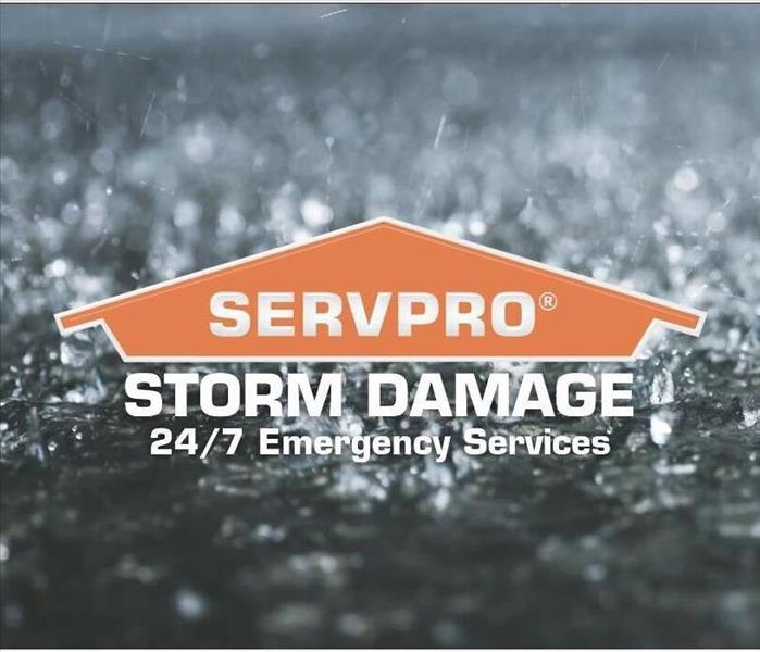 SERVPRO logo and says storm water with rain 