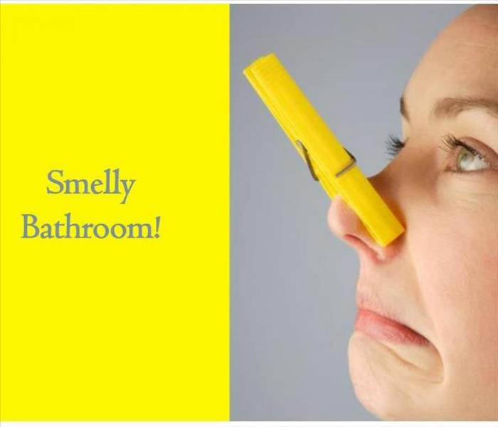 Women with paper clip over her nose and it says Smelly bathroom